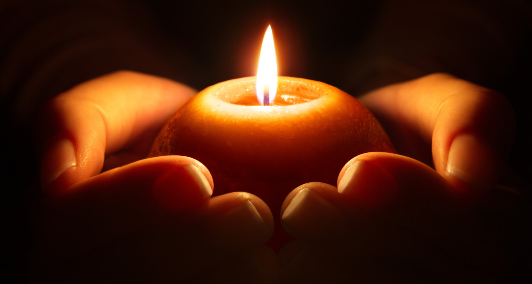 prayer - candle in hands - Beating Trauma